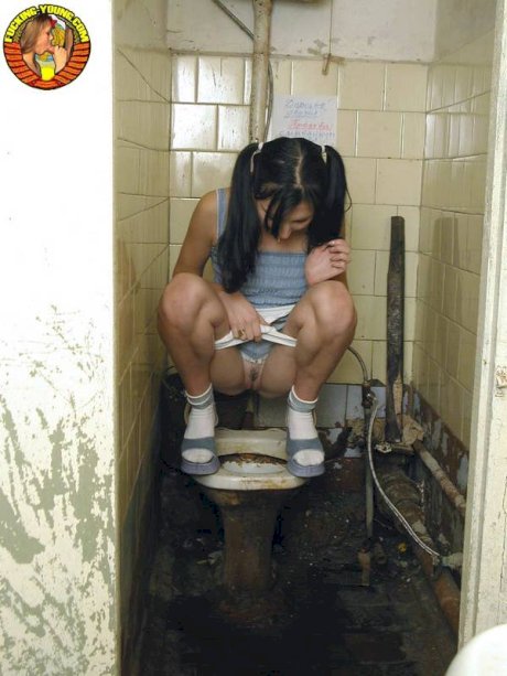 Teen girl in pigtails squats for a pee on the filthiest toilet know to mankind