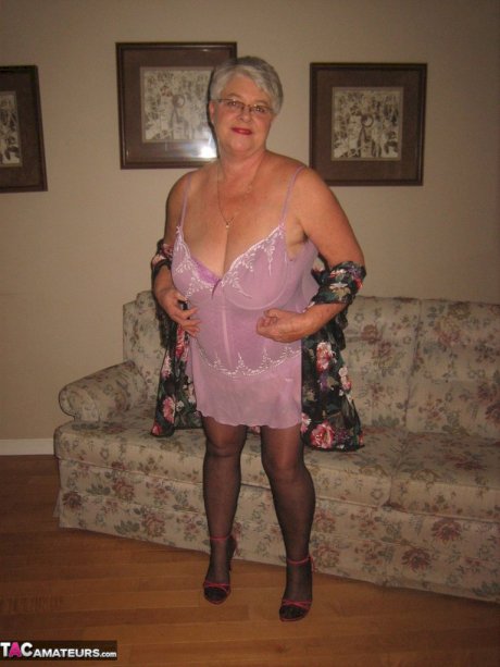 Fat granny Girdle Goddess lets her large boobs loose from lingerie