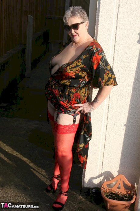 Old woman Valgasmic Exposed exposes saggy tits and big ass in yard