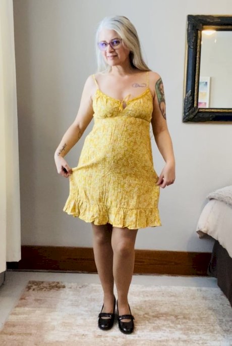 Platinum blonde amateur removes a yellow dress before pulling down her pantyhose - Photo 2