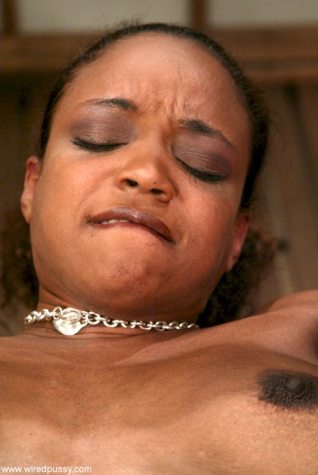 Ebony sub with big tits Sinnamon Love gets her pierced pussy toyed