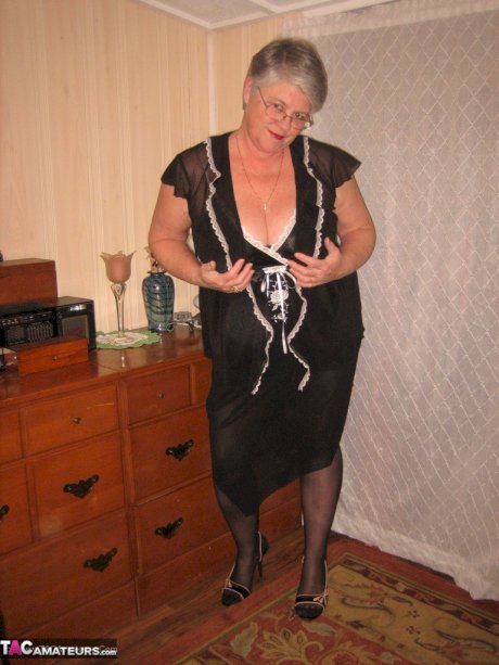 Overweight nan Girdle Goddess strips to her footwear in front of a dresser