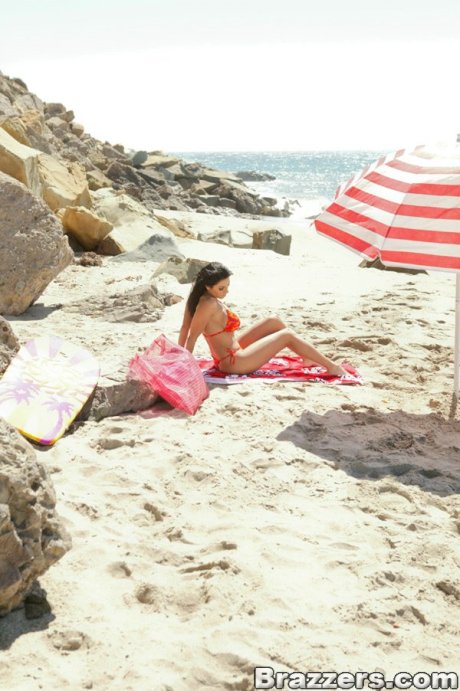 Horny MILF with a big ass Veronica Rayne exposes her big tits on the beach