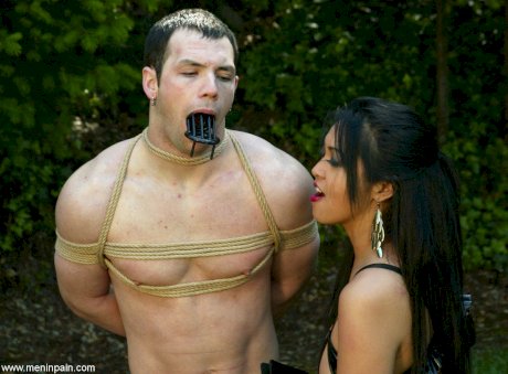 Nasty dommes take their male subs outside for rope bound CBT & humiliation