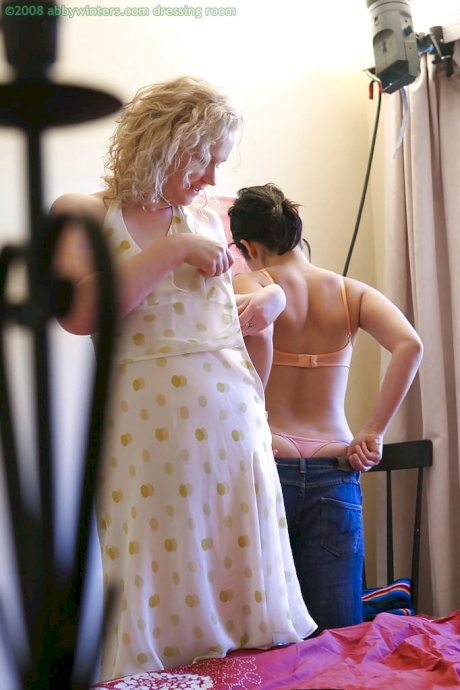 Spy camera catches two lesbians getting dressed after having sex - Photo 10