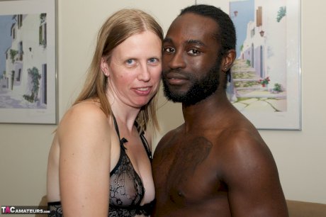 White amateur deepthroats her black lover's cock in lingerie ensemble
