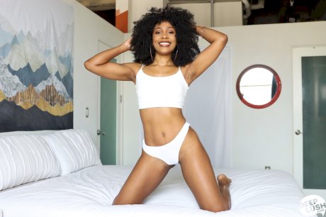 Ebony chick Olivia Jayy sports an afro while having POV sex on a bed
