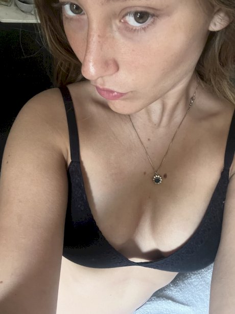 Blonde beauty Estell Aily purses her lips while posing in a bra and panty set