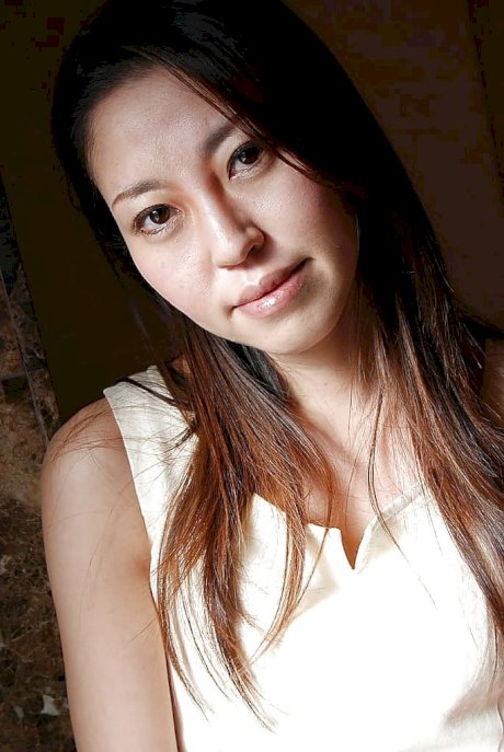 Foxy asian MILF Satomi Endou getting rid of her dress and lingerie - Photo 1