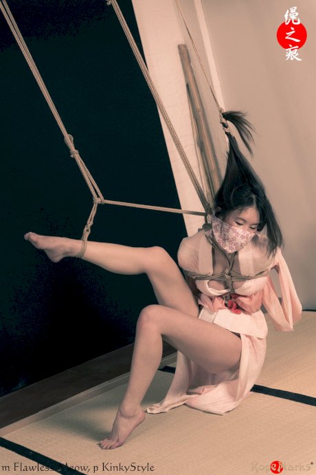 Asian chick Flawless Meow is tied with rope by her limbs and hair