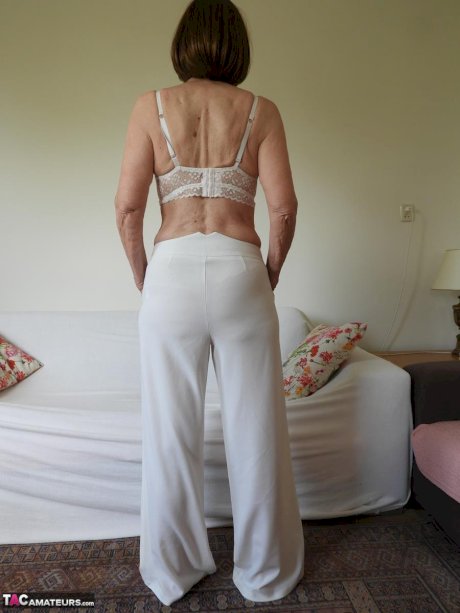Barefoot granny Kat Kitty gets completely naked during solo action