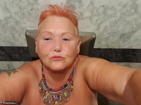 Fat granny with red hair Valgasmic Exposed takes naked selfies at home