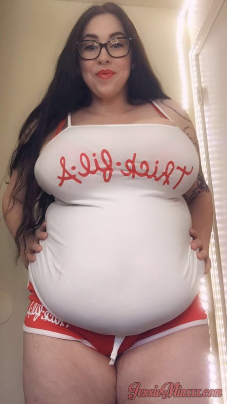 Tattooed fatty Jessie Minx showing off her hanging tits & her big tummy