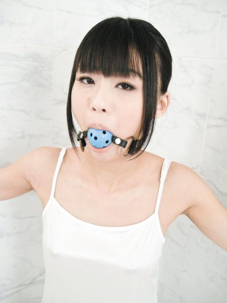 Japanese woman Chika Ishihara receives oral sex while restrained and gagged