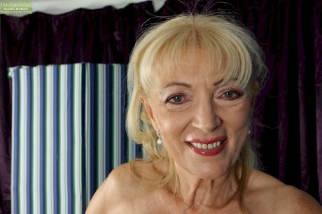 Blonde granny Janet Lesley exposes saggy boobs before spreading shaved twat