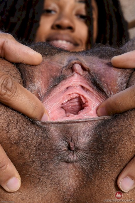 Black babe Olivia Green shows off her tiny tits & spreads her trimmed pussy
