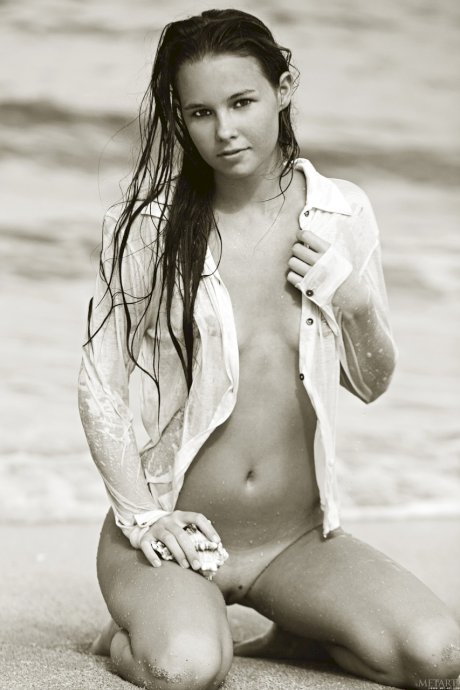 Teen Aria A poses nude on the sandy beach & shows her hot body with tan lines