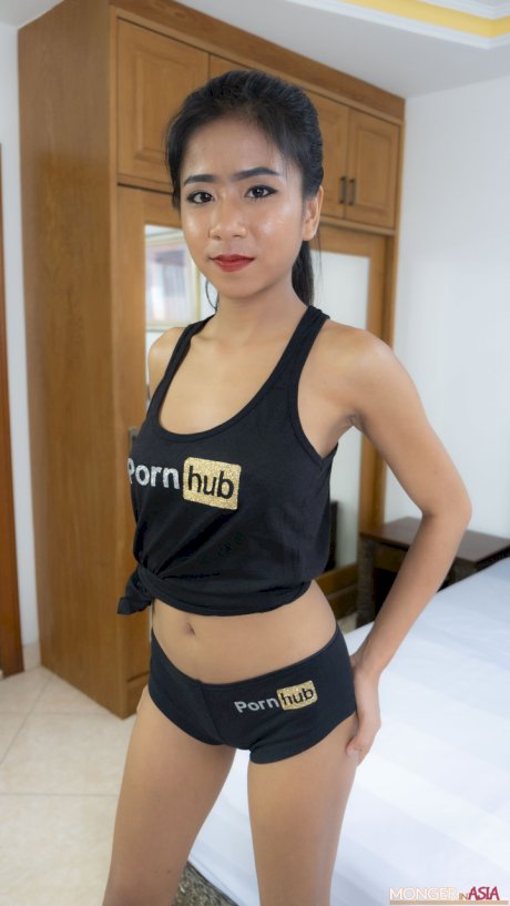 Thai beauty Som poses in her PornHub outfit & shows her big tits & ass