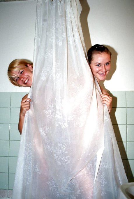 Sweet teenage gals with tiny tits taking a shower together - Photo 1