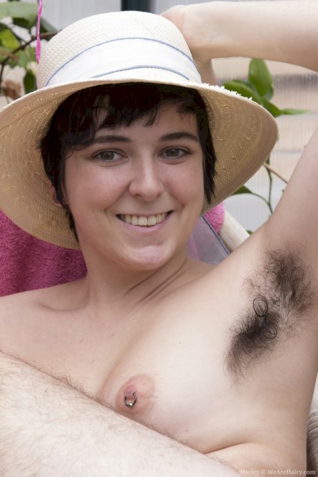 Short haired chick Harley unveils her hairy body, armpits, legs and pussy