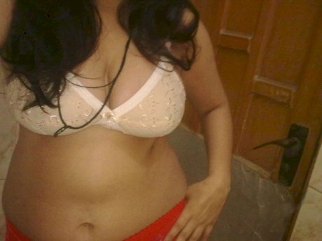 Overweight Indian student shows her bare mid-section in a brassiere