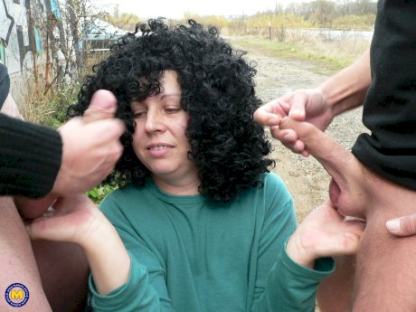Curly-haired amateur prostitute with big tits Johanna sucks 2 dicks in public - Photo 11