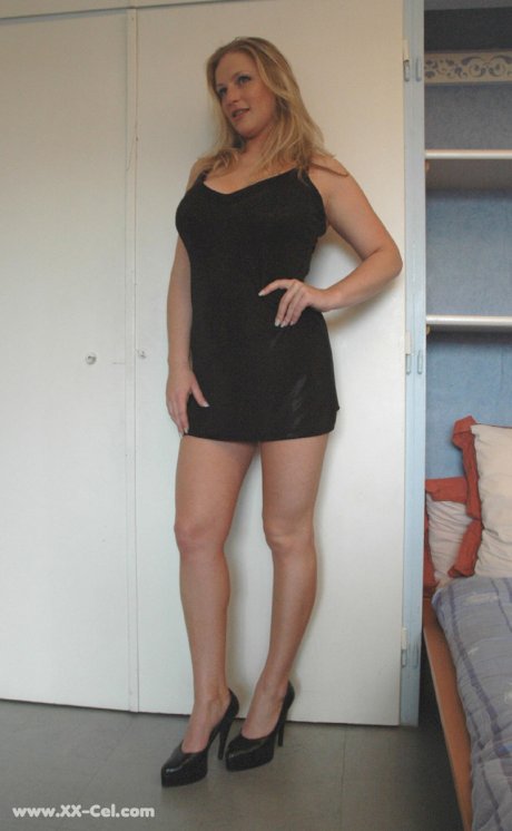 Beautiful amateur MILF in a black dress Zdenka K exposes her sexy legs and ass