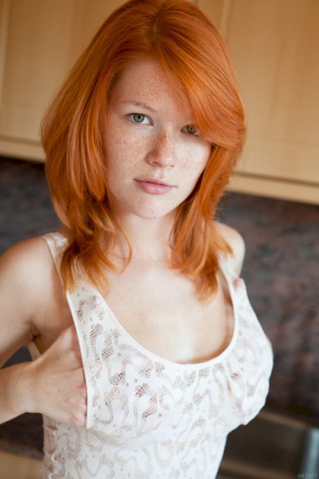 Gorgeous freckled redhead Mia Sollis flaunts her hot titties and tasty muff