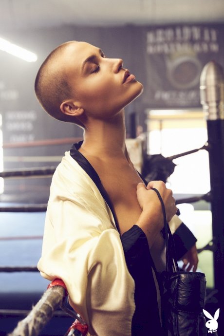 Athletic woman Vendela models semi-nude in boxing attire with a sweat on