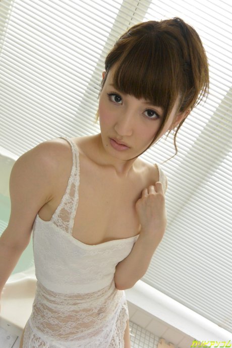 Slim Asian babe Karin Aizawa strips to white stockings and rides a toy