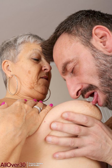 Older granny Savana bares big saggy tits to fuck young man's hard cock cowgirl