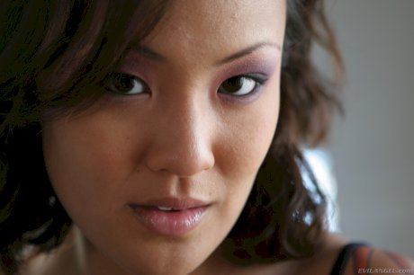 Tattooed Asian pornstar fooling around with some kinky sex toys