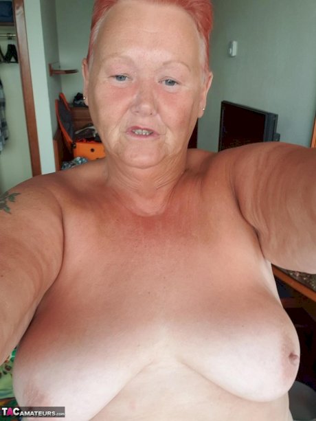 Fat granny with red hair Valgasmic Exposed takes naked selfies at home