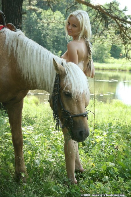 Teen equestrian with tiny titties Ira doffs her white dress and poses naked - Photo 8
