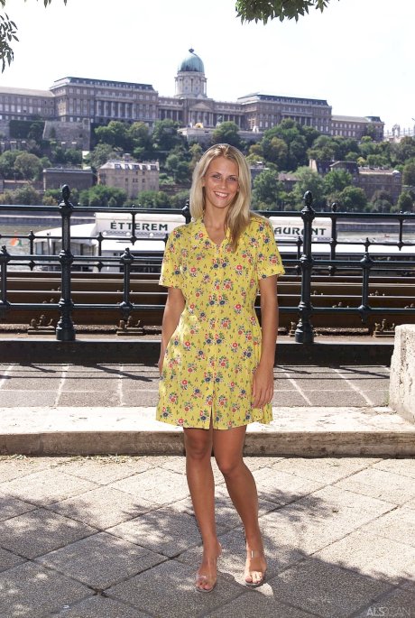 Blonde teen Krisztina removes her yellow dress and flaunts her body in public - Photo 10