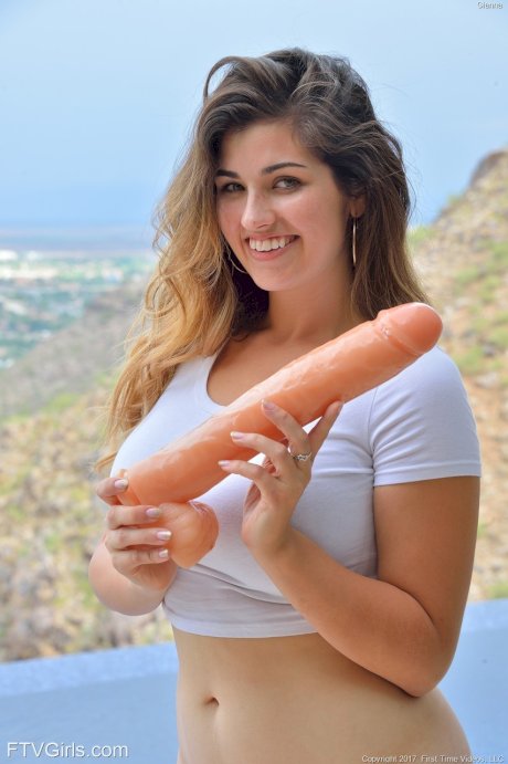 Cute teen girl inserts a huge dildo into her pussy before self fisting
