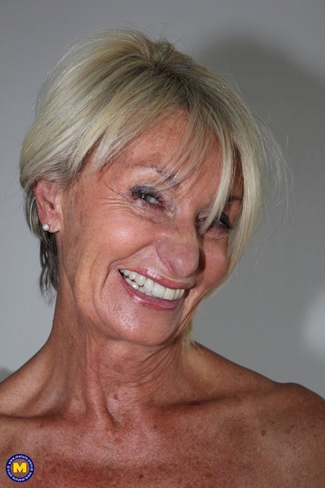 Old blonde woman removes black pantyhose to spread her pussy lips - Photo 19