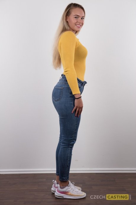 Fully clothed 18 year old Silvie stands butt naked after removing her clothes