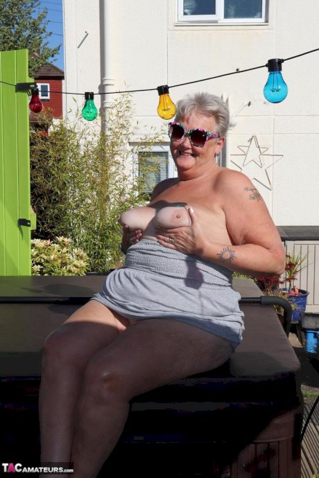 Fat nan Valgasmic Exposed licks a shoe while exposing herself in the backyard