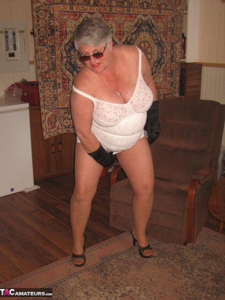 Fat granny Girdle Goddess gets naked in shades, gloves and pantyhose