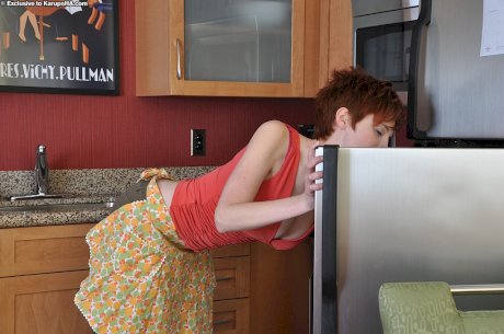 Big busted redhead with unshaven twat getting rid of her clothes