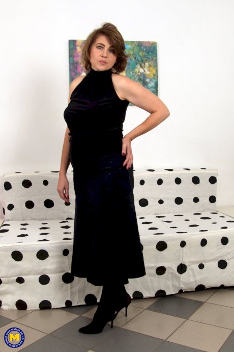 Dirty mature Larisa masturbates with a long dildo as she's home alone & horny - Photo 1