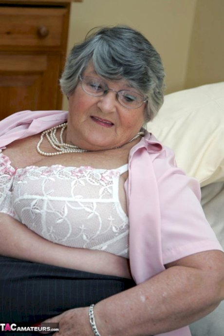 Obese granny Grandma Libby gets completely naked on a leather chesterfield