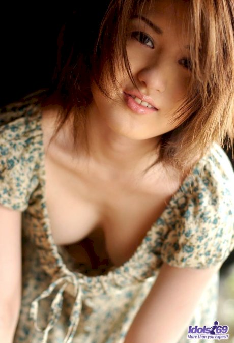 Young Japanese girl with red hair exposes firm tits and sheer panties