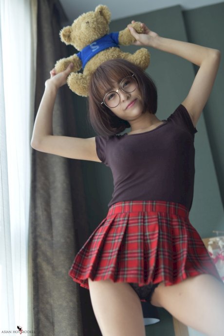 Pretty Asian teen flaunts her hot ass wearing a miniskirt and panties