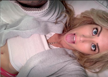 Blonde solo model Capri Cavanni takes self shots during non-nude action