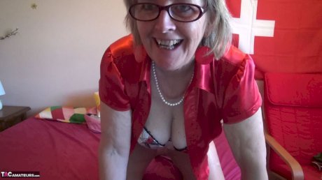 Old amateur Abby Roberts sucks and tugs on a cock with her glasses on
