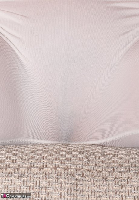 Mature amateur Dimonty models non nude in an off shoulder top and tight pants