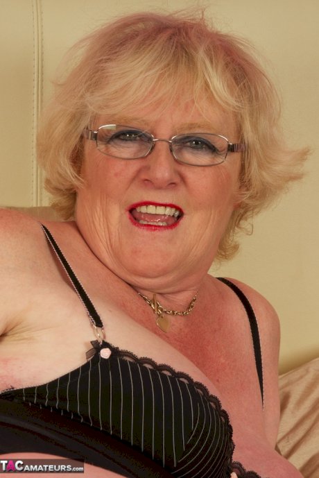 Sassy fat granny Claire Knight hikes her skirt to toy her horny old pussy