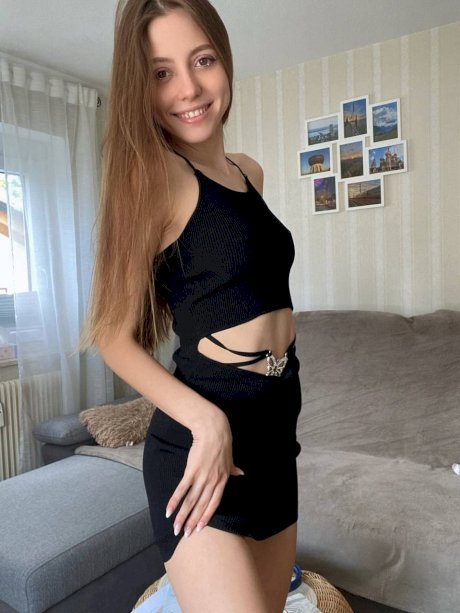 Amateur girl with long hair takes selfies in a variety of outfits - Photo 12